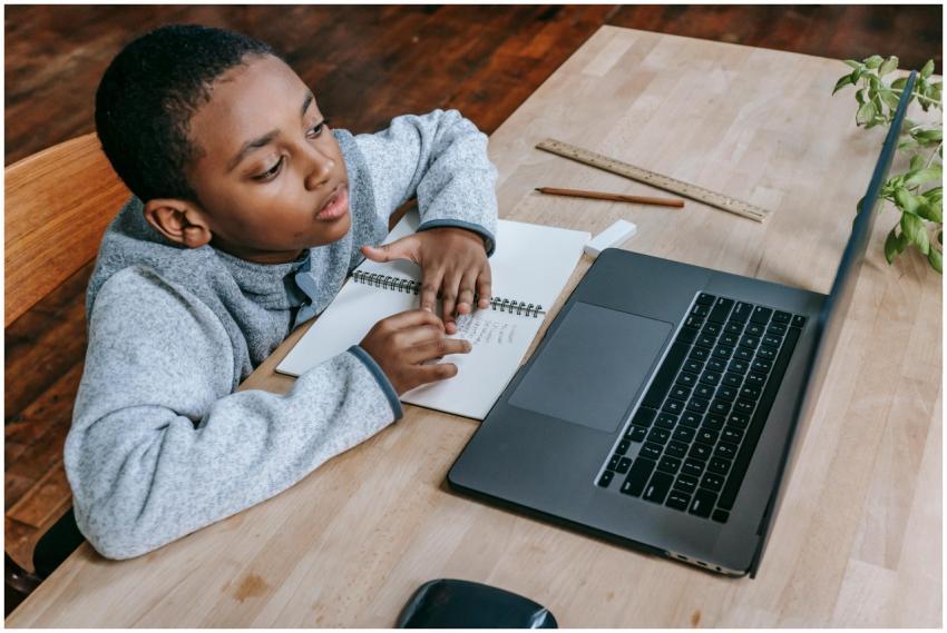 From above of smart cute African American boy stud