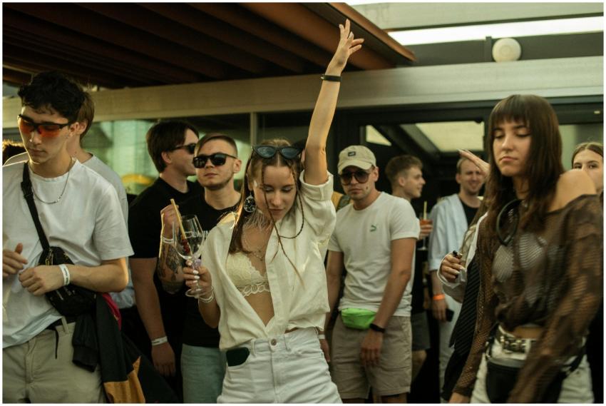 Vibrant party atmosphere with people dancing and e