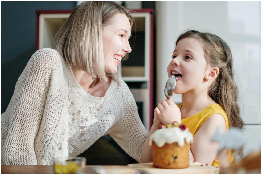 A joyful moment of mother and daughter baking and