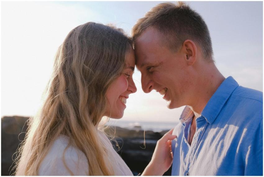 A loving couple shares a joyful moment outdoors, d