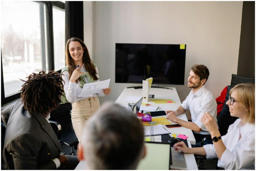 Team engaged in a collaborative office meeting, di