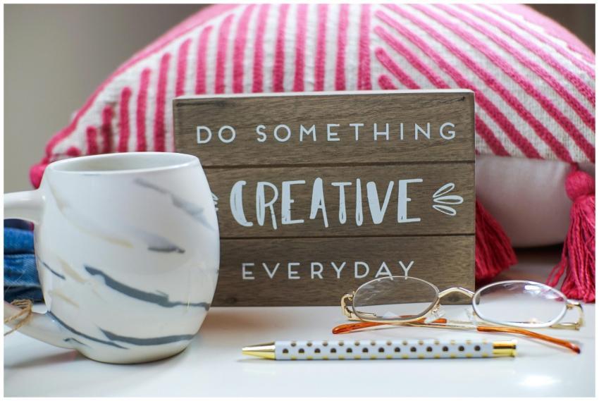 Stylish desk setup with a coffee mug, eyeglasses,