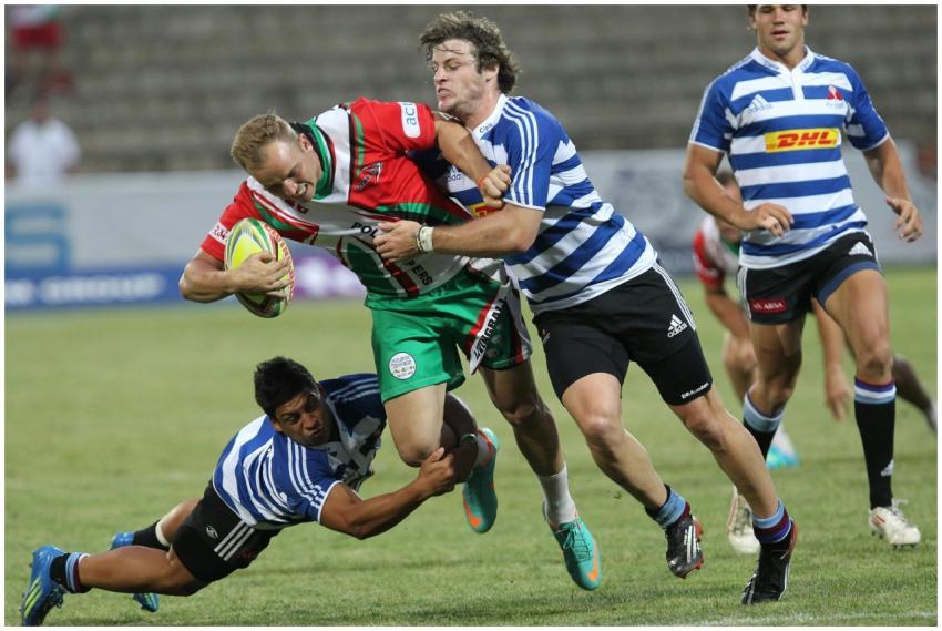 Dynamic action shot of rugby players in a fierce t