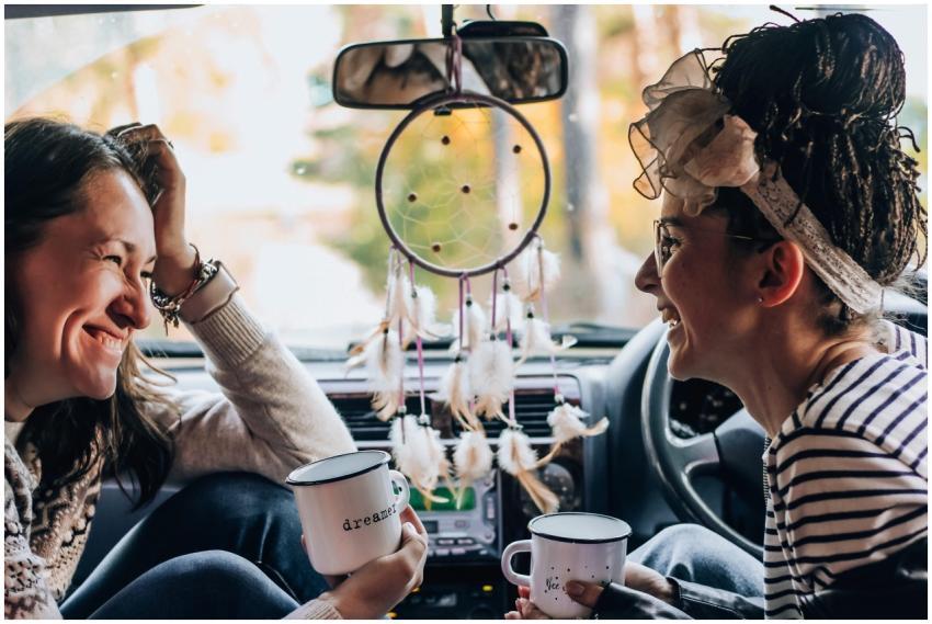 Two women enjoying a cheerful conversation in a pa