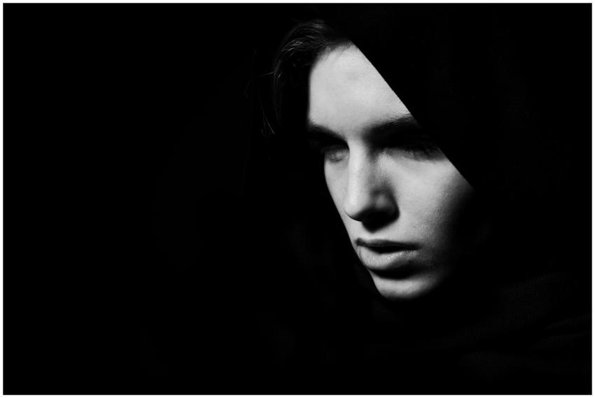 Dramatic black and white portrait of a woman in lo