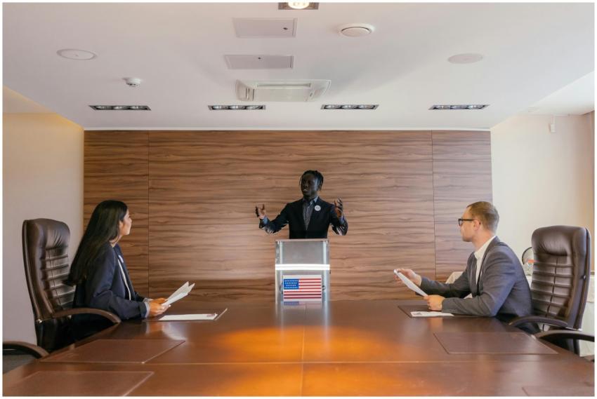 Three professionals deliberating in a modern confe
