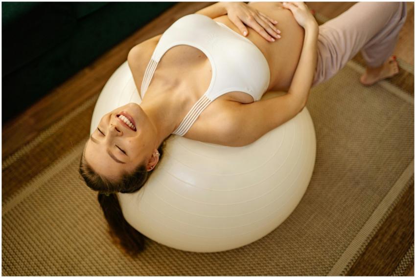 Caucasian pregnant woman smiling while resting on