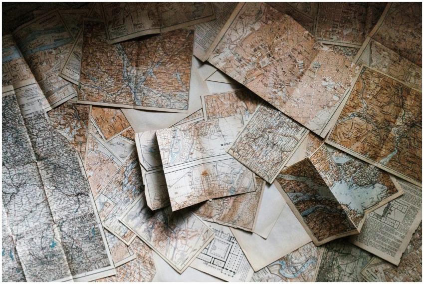 A collection of vintage maps scattered for explori