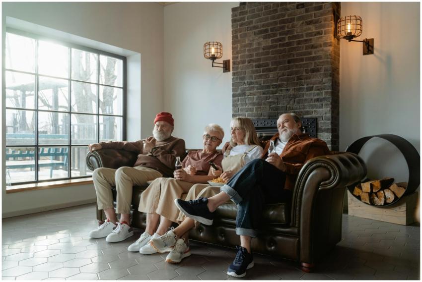 A group of senior adults relaxing comfortably indo
