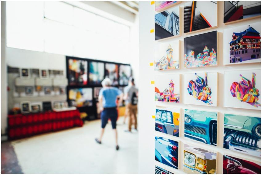 Colorful artwork showcased in a modern gallery set