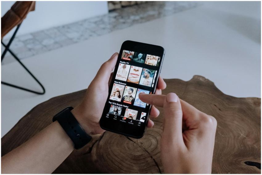 A person using a smartphone to explore and select