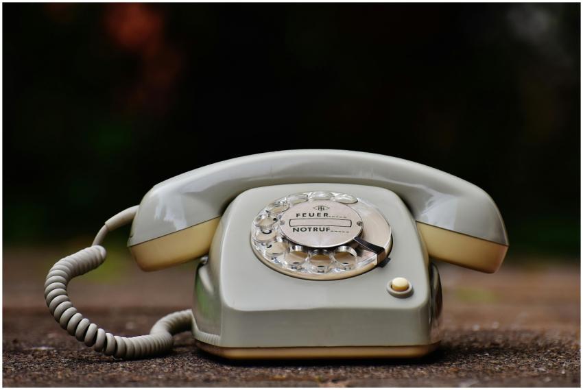Close-up of a vintage rotary dial telephone with a