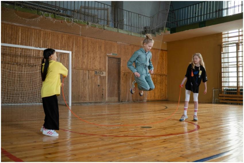 Children having fun with a jump rope during a play