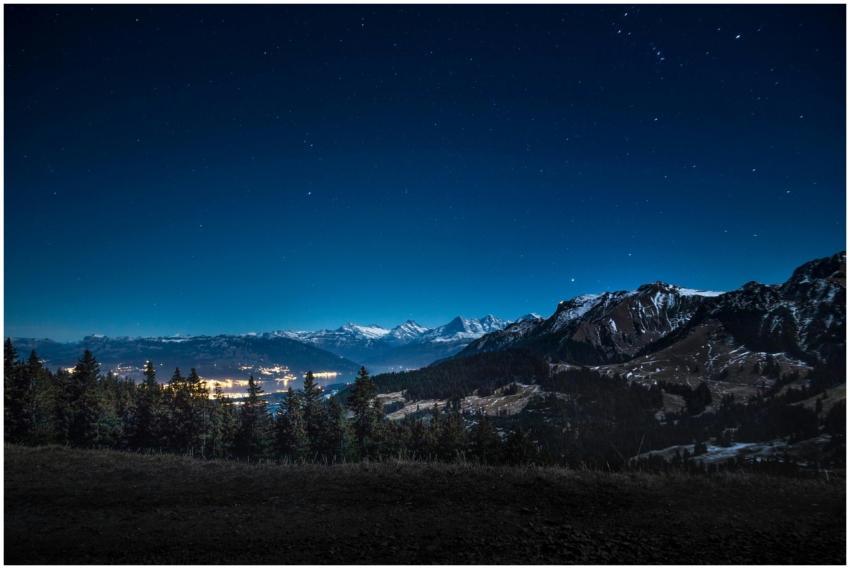 Captivating starry night overlooking illuminated t