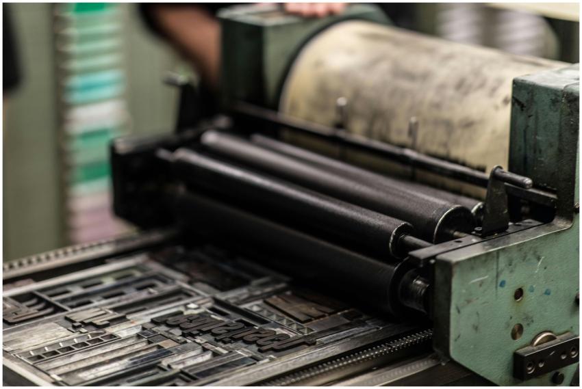 Detailed view of an industrial printing press with