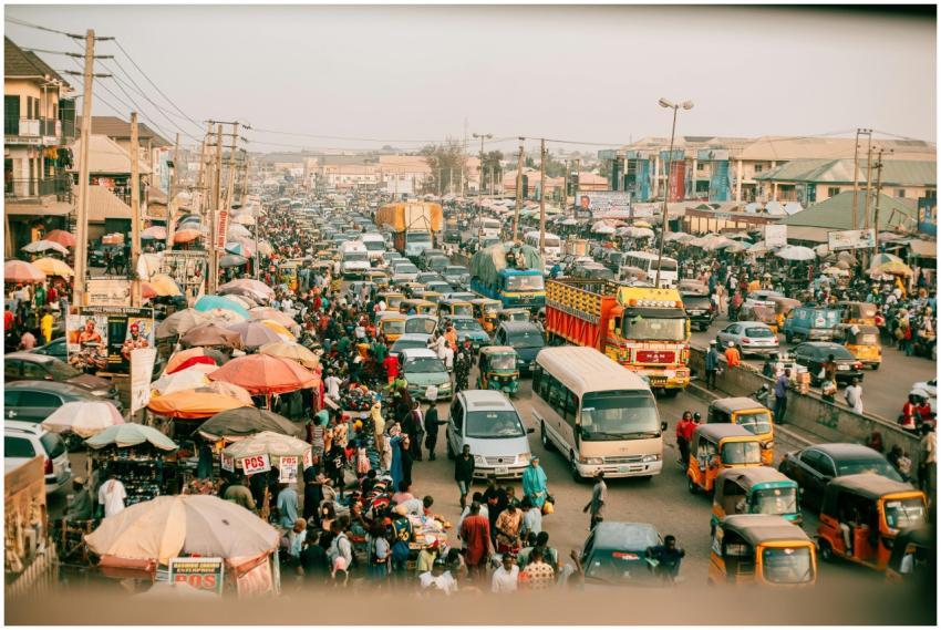 A lively street market with busy traffic in a vibr