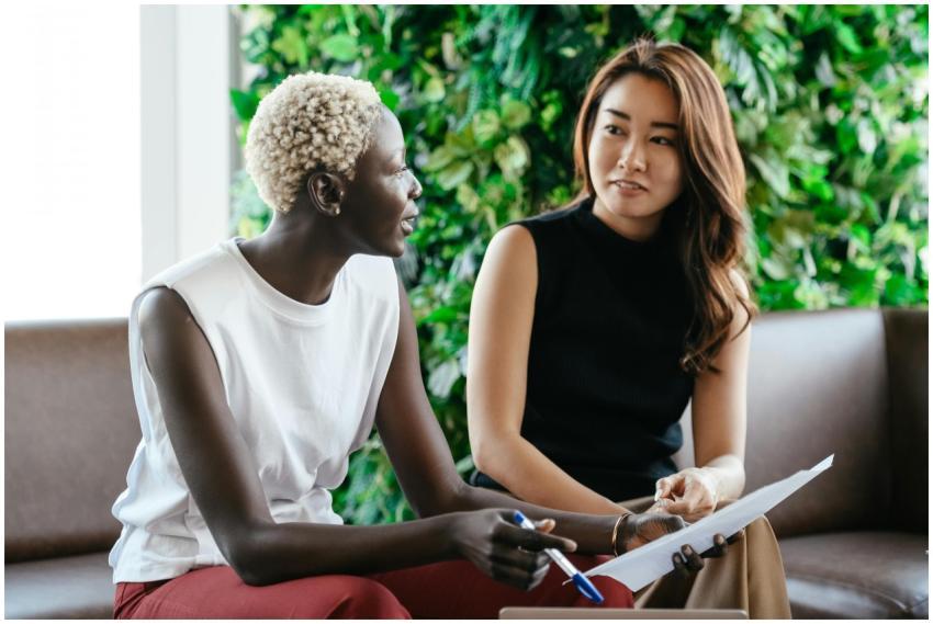 Diverse women talking about job while discussing c