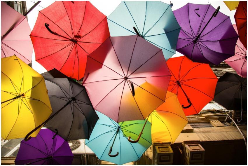 A dynamic array of colorful umbrellas creates a vi