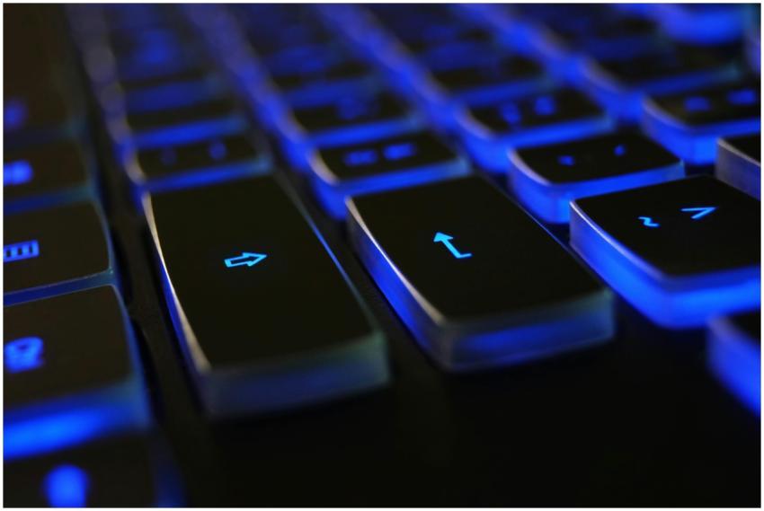 Detailed image of a computer keyboard with blue LE