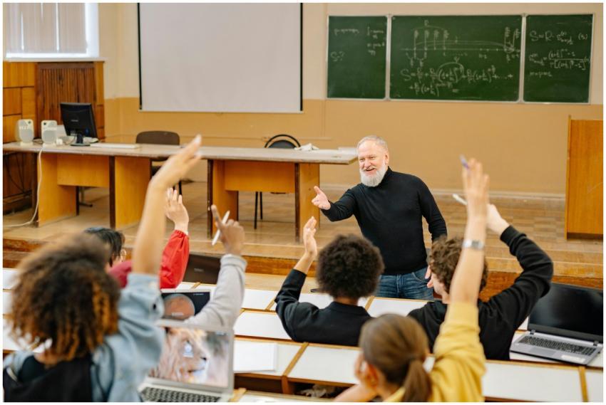 Professor engaging with students in a lively unive