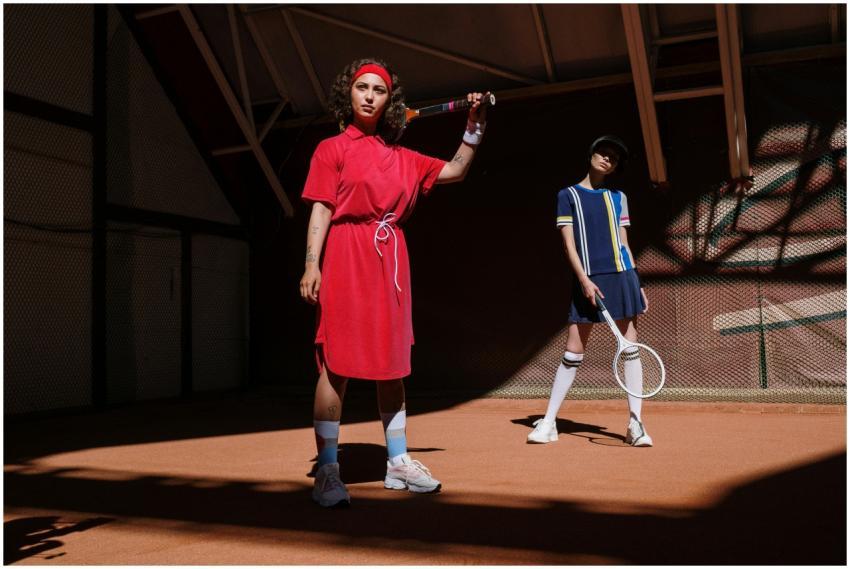 Two women in vibrant sportswear posing confidently