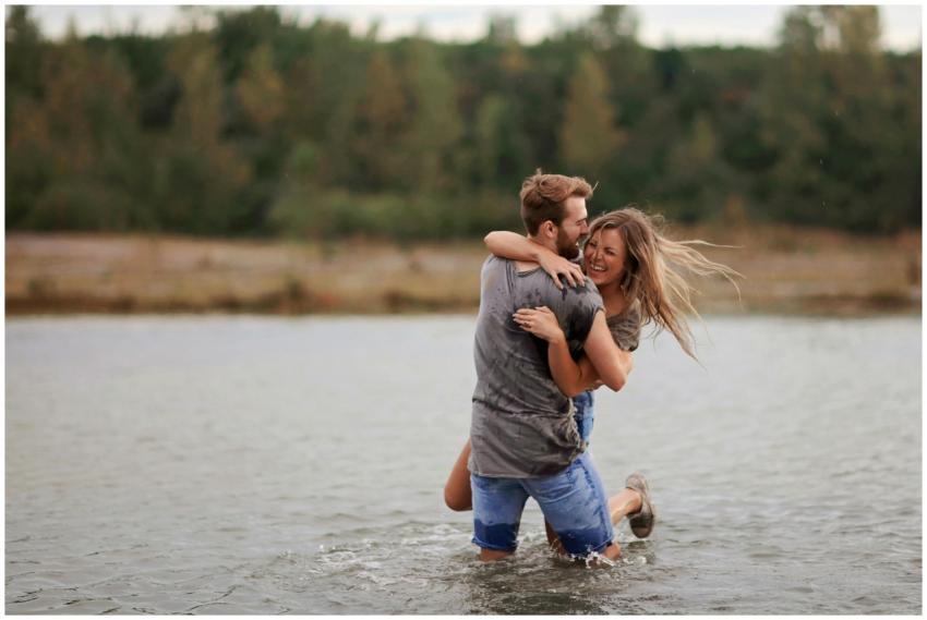 A young couple joyfully playing in the water again