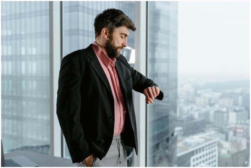 Confident businessman in an office looking at his