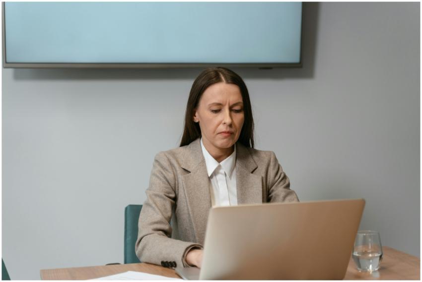 Businesswoman in an office setting focusing on her