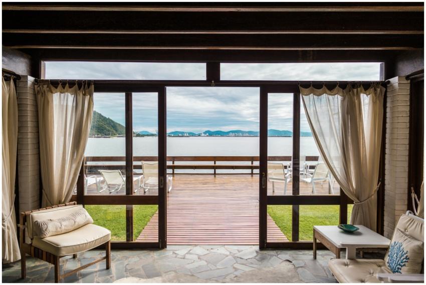 Elegant room with ocean view from large windows ov