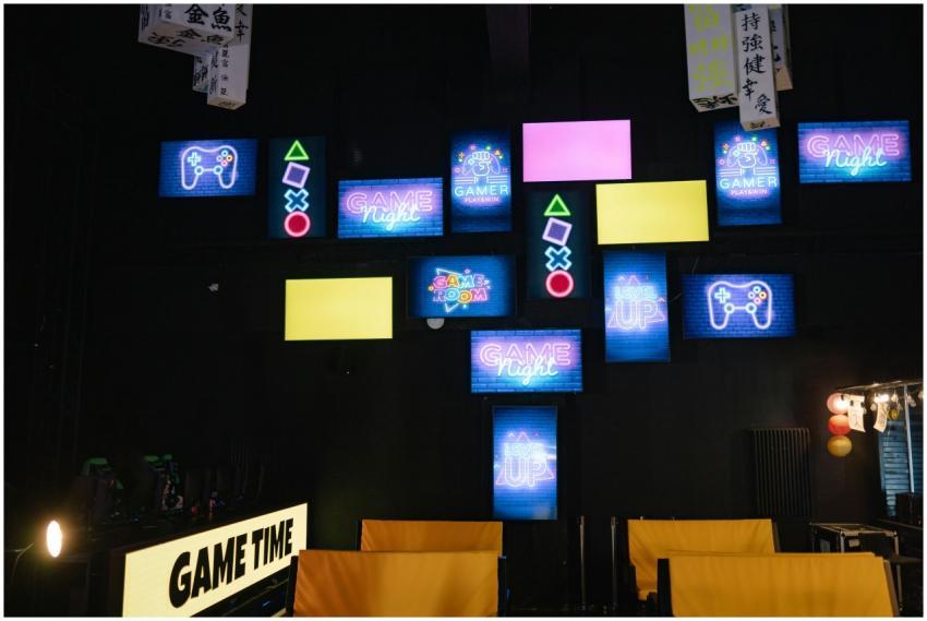 A lively gaming room displaying bright neon signs