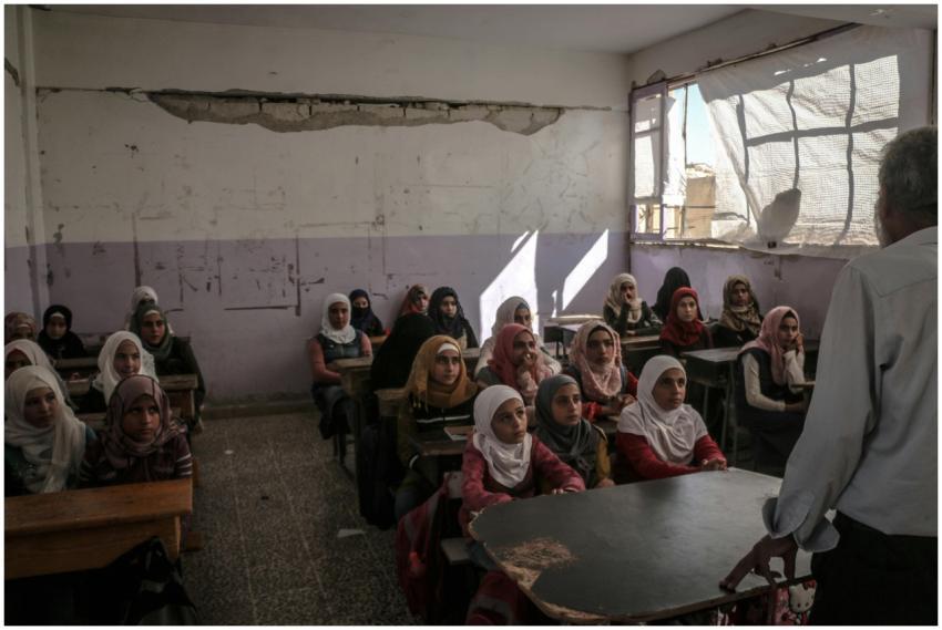 Female students in a classroom in Idlib, Syria, re