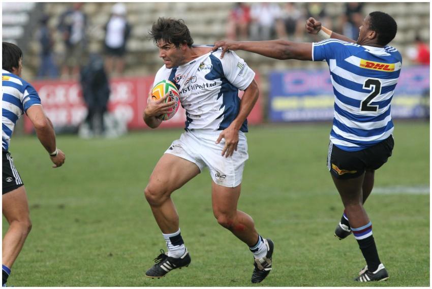 Rugby players in motion during a competitive game