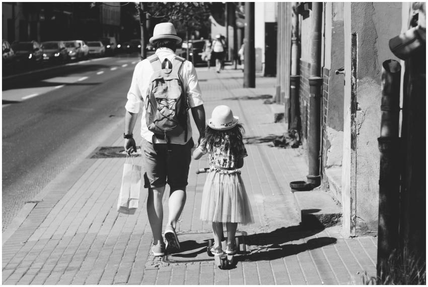 Monochrome image of a father and daughter holding