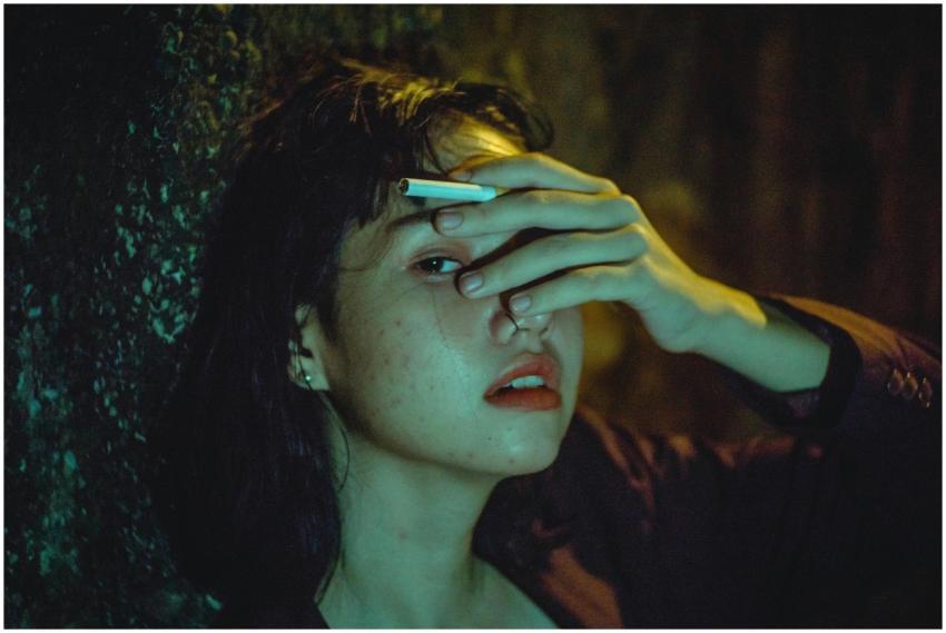 Dramatic portrait of a woman in low light, express