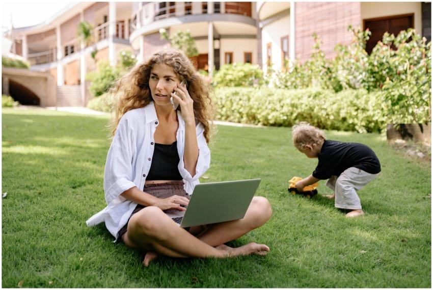Woman multitasking on phone and laptop while child