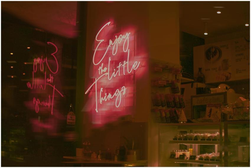 Vibrant neon sign reading 'Enjoy the Little Things