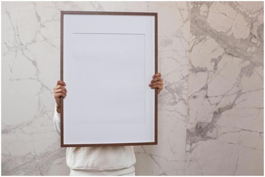 Crop anonymous person demonstrating white empty fr