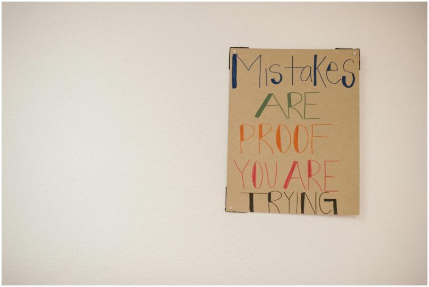 A motivational poster with the phrase 'Mistakes ar