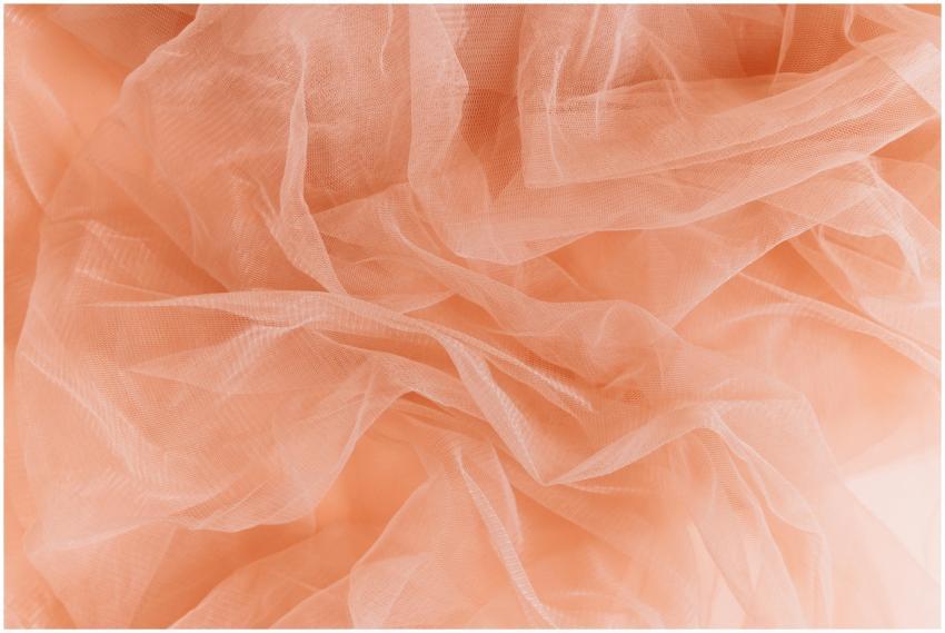 Capture of delicate peach tulle fabric showcasing
