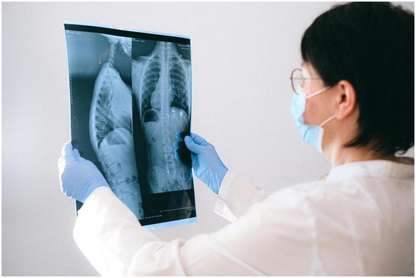 Medical professional in mask and gloves examining