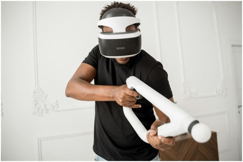 A man wearing VR glasses actively engaged in a vir