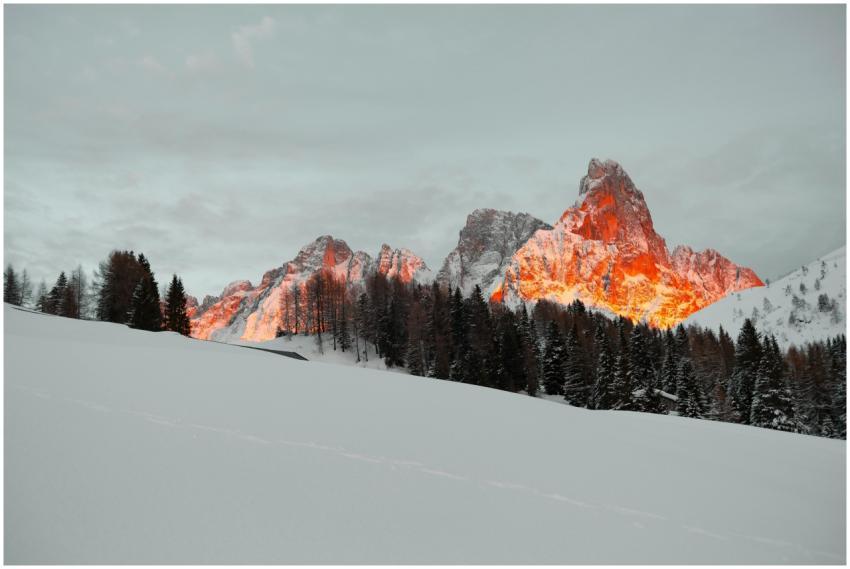 Majestic sunset illuminating snow-covered Dolomite