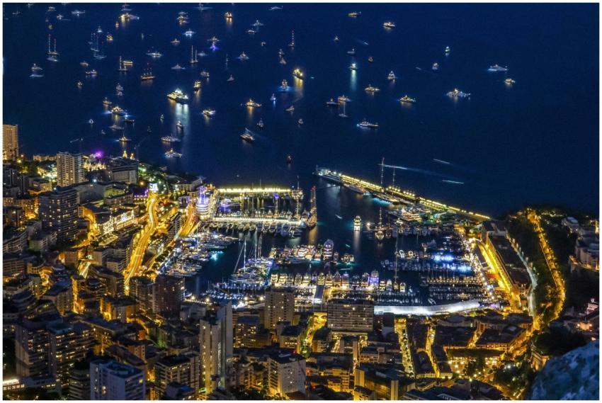 A breathtaking aerial night view of Monaco's illum