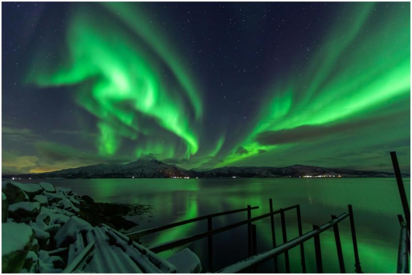 Dazzling Northern Lights illuminate a tranquil Lød