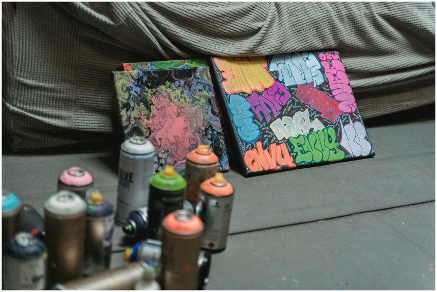 Close-up of canvas artwork with colorful graffiti