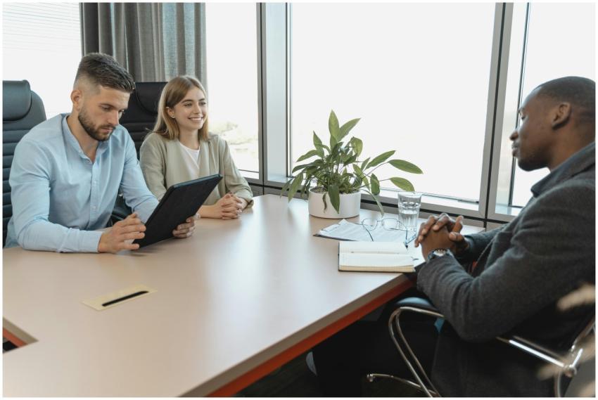 A business interview with three people in a modern