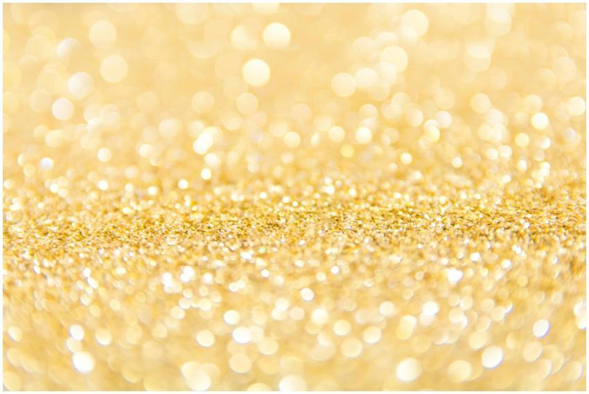 Abstract gold glitter background with a bokeh effe