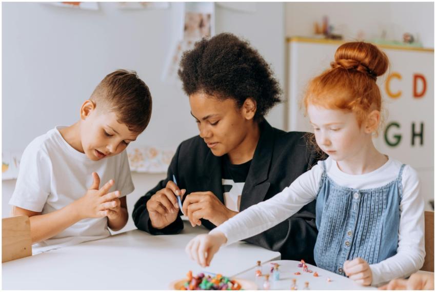 Teacher engaging with children in a classroom sett