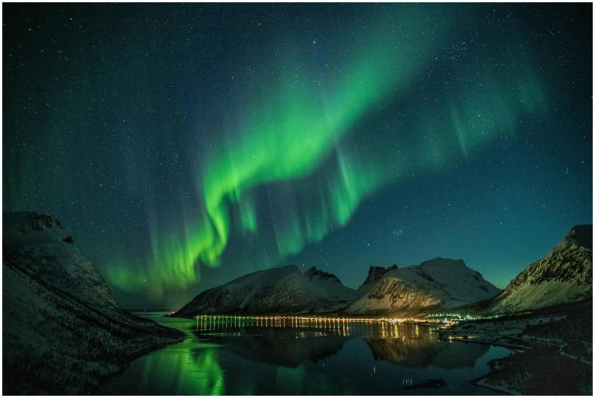 Mesmerizing northern lights illuminating snowy mou