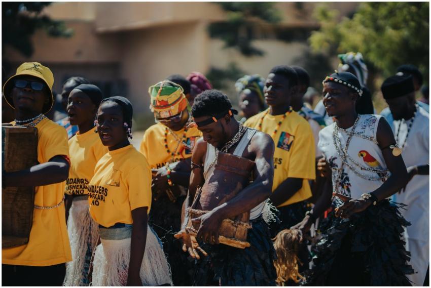 Group of adults in traditional African attire part